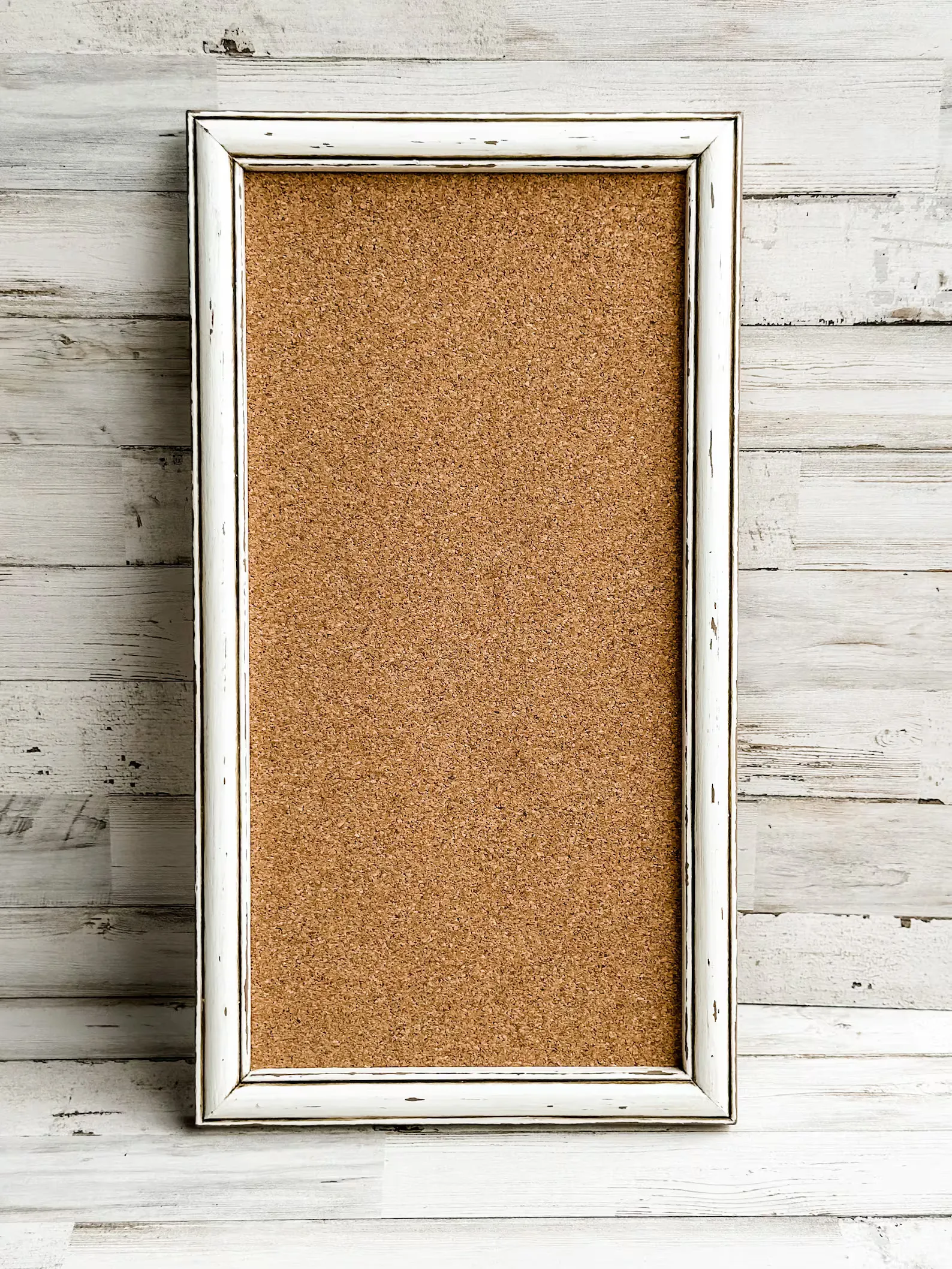 Framed antique white distressed cork board