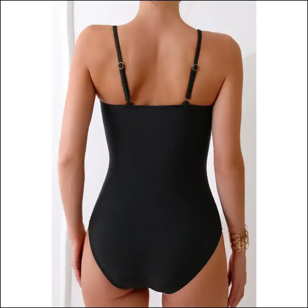 Get Ready to Turn Heads in our Cutout Spaghetti Strap One-piece! 😎✨